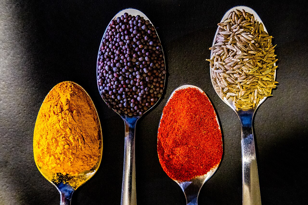Colourful Indian spices in metal bowls