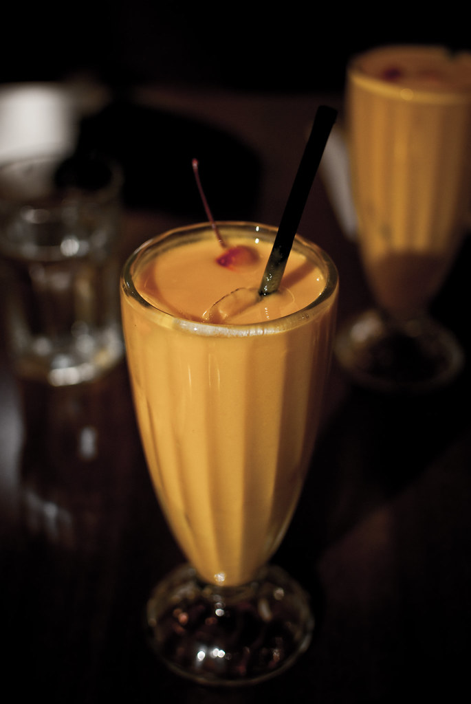 Tall glass of thick mango lassi